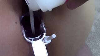 Spreading my twat open with a speculum and filling it with fake sperm until it's full